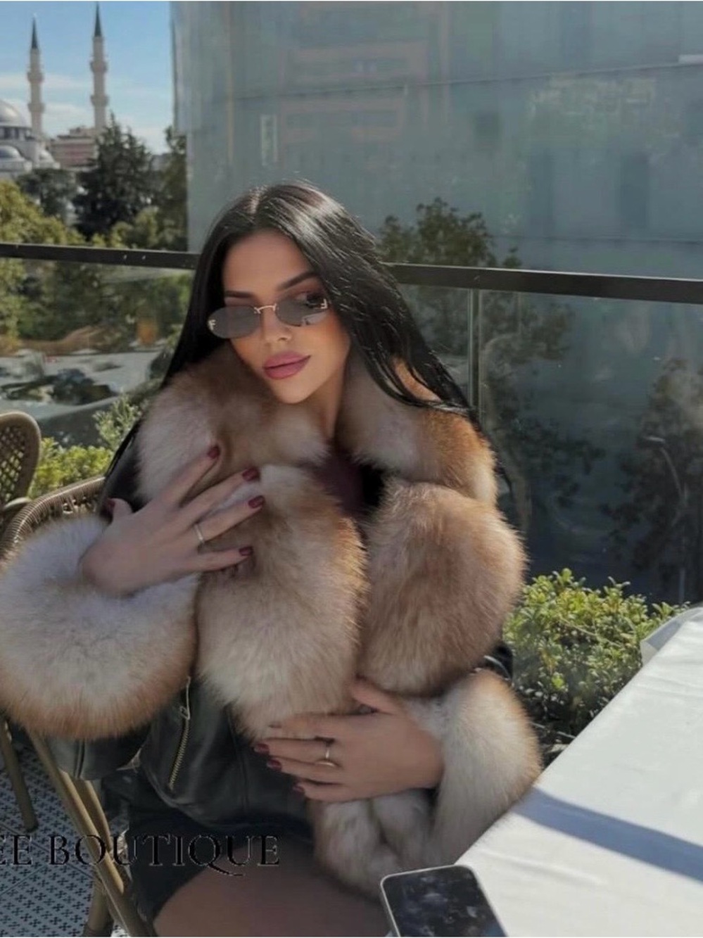 Luxury leather jacket with fox fur details